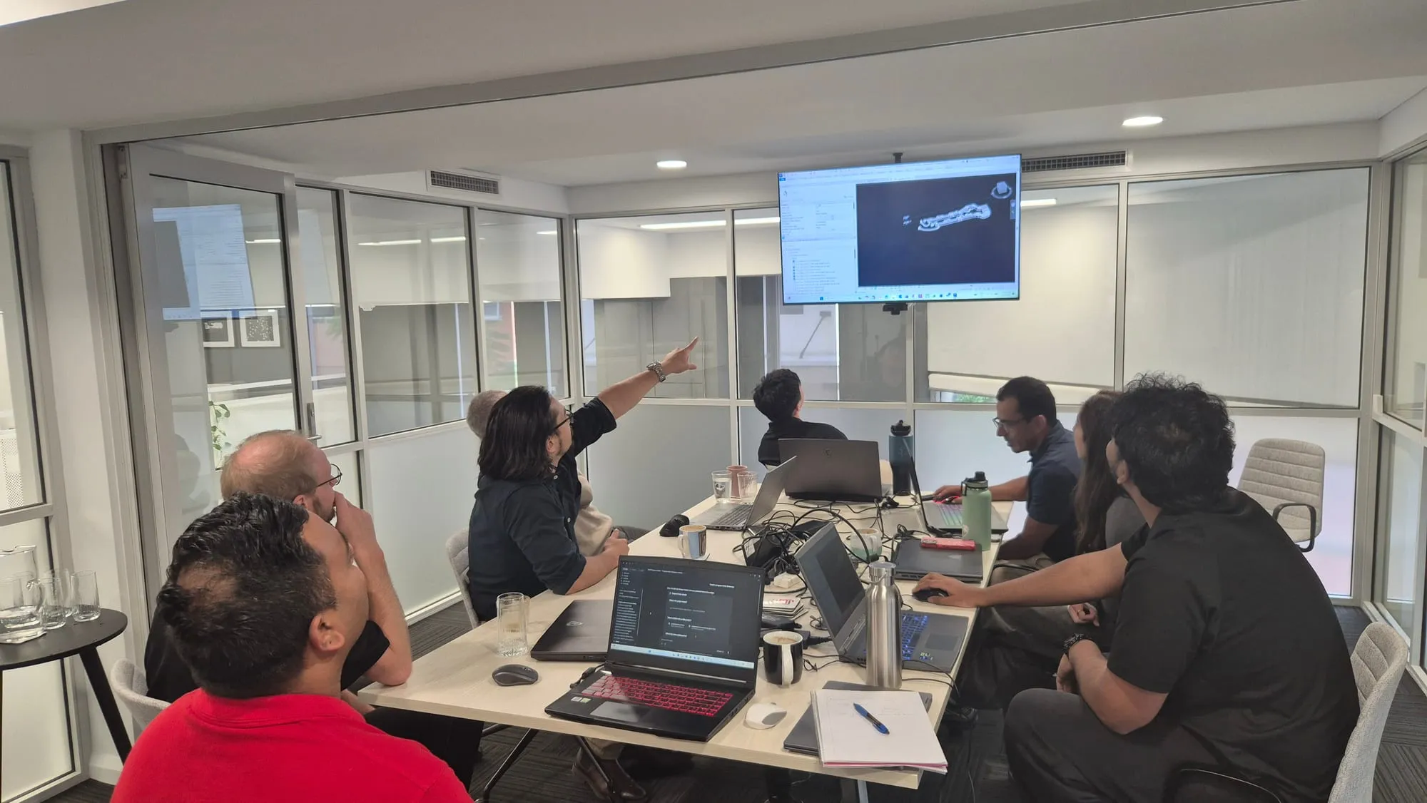 The Devlin Engineering team in an AI Execution Sprint working session, one participant pointing to the screen